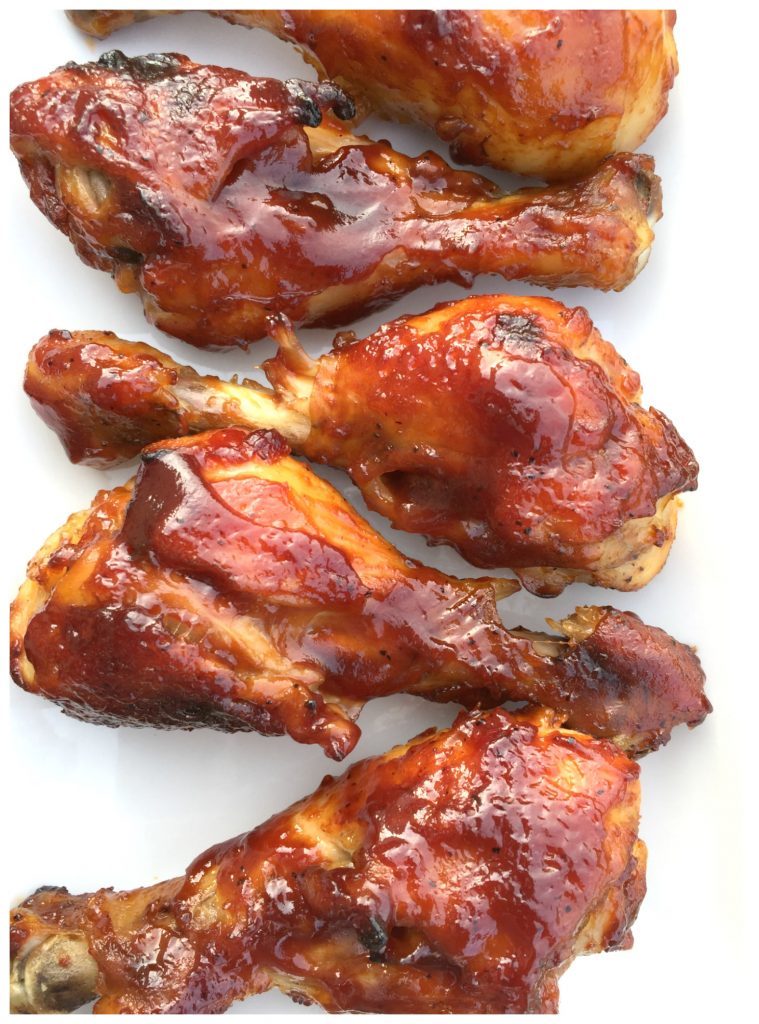 close up of oven bbq chicken drumsticks