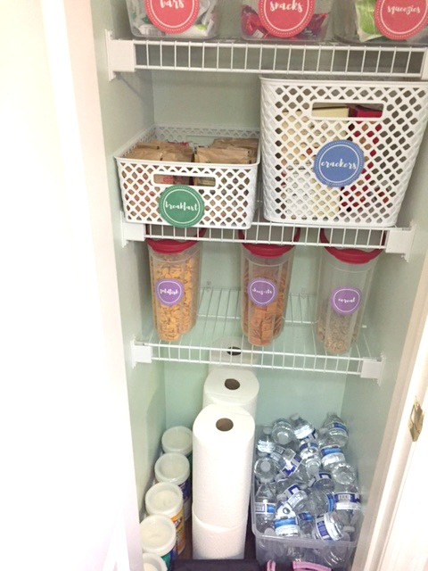 small pantry organization - lower half of pantry including paper towel, clorox wipes and mini water bottles