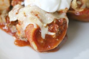 taco stuffed shells with melted cheese and toasty tortilla chips